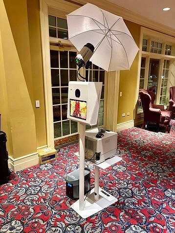 “Photo booth rental setup with premium backdrop, lighting, and printer for special events”